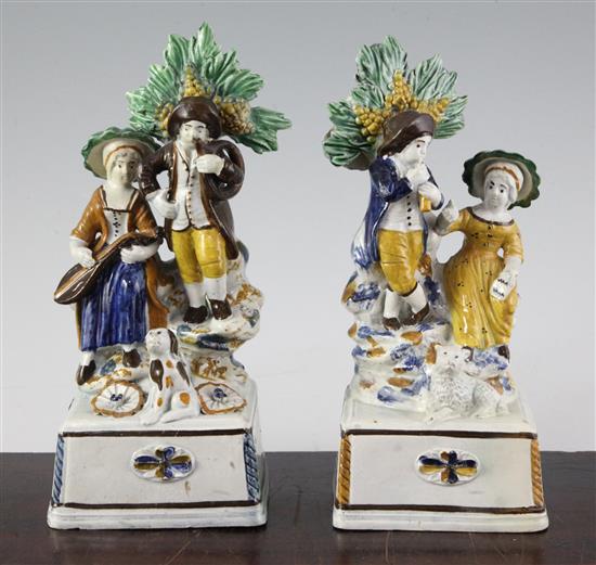 A pair of Pratt-type pearlware groups, c.1810, 21.5cm and 21cm, some high quality restoration